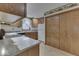 Functional kitchen with wooden cabinets, white appliances, and a decorative wallpaper border at 613 Brook Dr, Greenwood, IN 46143