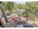 Beautiful backyard area with a fire pit surrounded by red Adirondack chairs at 6420 Oriole Dr, Nineveh, IN 46164