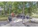 Backyard patio area with grill and shed, offering lake views and outdoor amenities at 6420 Oriole Dr, Nineveh, IN 46164
