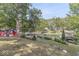 Beautiful backyard view overlooking the lake and featuring mature trees and lush greenery at 6420 Oriole Dr, Nineveh, IN 46164