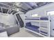 Finished basement area with bunk beds, stairs, and a comfortable seating area at 6420 Oriole Dr, Nineveh, IN 46164