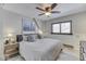 Comfortable bedroom featuring a beach theme, ceiling fan, and a window with natural light at 6420 Oriole Dr, Nineveh, IN 46164