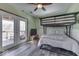 Spacious bunkroom with french doors that offer access to a deck at 6420 Oriole Dr, Nineveh, IN 46164