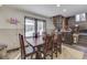 Charming dining area with a large table, windows to the outside, and spiral stairs nearby at 6420 Oriole Dr, Nineveh, IN 46164