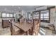 Open-concept dining area with a large table, open to the bright and airy kitchen at 6420 Oriole Dr, Nineveh, IN 46164