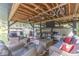 Comfortable dock with cozy seating, ceiling fans, and a mounted television for outdoor relaxation at 6420 Oriole Dr, Nineveh, IN 46164