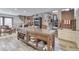 Open-concept kitchen with a large island, nearby dining area, and decorative stone elements at 6420 Oriole Dr, Nineveh, IN 46164