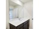 Contemporary bathroom featuring a vanity with a sink, a large mirror and views into the next room at 7161 Jackson Dr, Cumberland, IN 46229