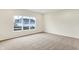 Bright bedroom with neutral carpet, large windows, and ample space at 7161 Jackson Dr, Cumberland, IN 46229