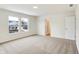 This carpeted bedroom has two windows offering natural light and a view of the home's surroundings at 7161 Jackson Dr, Cumberland, IN 46229