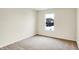 Bright bedroom featuring a large window that illuminates the cozy, carpeted space at 7161 Jackson Dr, Cumberland, IN 46229
