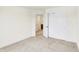 A serene bedroom with neutral-colored walls and a closet with sliding doors at 7161 Jackson Dr, Cumberland, IN 46229