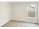 Empty bedroom featuring neutral carpet and walls and natural light from the single window at 7161 Jackson Dr, Cumberland, IN 46229