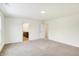 Bedroom with white walls, neutral carpet, and access to bathroom at 7161 Jackson Dr, Cumberland, IN 46229