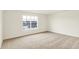 Bedroom with neutral carpet, white walls and a window with a view at 7161 Jackson Dr, Cumberland, IN 46229