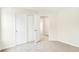 This carpeted bedroom is equipped with a closet, and the doorway provides views to other rooms at 7161 Jackson Dr, Cumberland, IN 46229
