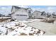 Two-story home with white siding, covered porch, two-car garage, and concrete driveway at 7161 Jackson Dr, Cumberland, IN 46229