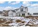 Charming two-story home with white siding, covered porch, and spacious front yard at 7161 Jackson Dr, Cumberland, IN 46229