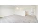 Carpeted loft features white walls and access to additional rooms at 7161 Jackson Dr, Cumberland, IN 46229