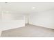 Spacious loft with neutral carpet and white walls at 7161 Jackson Dr, Cumberland, IN 46229