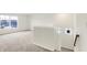 Loft features neutral carpet and staircase to the second floor at 7161 Jackson Dr, Cumberland, IN 46229