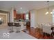 Modern kitchen with stainless steel appliances, breakfast bar, and an adjacent dining area at 9506 Oakley Dr, Indianapolis, IN 46260