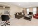Cozy living room with neutral walls, carpeted floors, and a large window providing natural light at 9506 Oakley Dr, Indianapolis, IN 46260