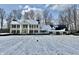 Exterior shot of stately brick home featuring classic columns and a snow-covered yard at 10 Point Ln, Arcadia, IN 46030