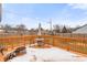 Spacious back deck with a table, chairs, and a fire pit, perfect for outdoor gatherings at 10156 Park Royale Dr, Indianapolis, IN 46229