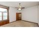Spacious bedroom with neutral carpet, ceiling fan, and natural light from a window at 10156 Park Royale Dr, Indianapolis, IN 46229
