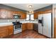 Efficient kitchen features stainless steel appliances, wood cabinets, and durable counter tops at 10156 Park Royale Dr, Indianapolis, IN 46229