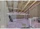 Unfinished attic space showing insulation and wooden support beams at 1032 E Woodall Ct, Martinsville, IN 46151