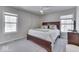 Spacious bedroom features a ceiling fan, windows with natural light and neutral color scheme at 1032 E Woodall Ct, Martinsville, IN 46151