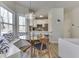 Inviting dining area with modern lighting, breakfast nook, and adjacent kitchen at 1032 E Woodall Ct, Martinsville, IN 46151