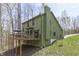 Exterior view featuring a spacious deck ideal for entertaining and surrounded by lush greenery at 1032 E Woodall Ct, Martinsville, IN 46151