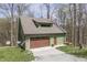 Charming home with a garage and inviting deck, nestled in a beautiful, wooded area at 1032 E Woodall Ct, Martinsville, IN 46151