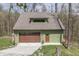 Charming home with a garage and inviting deck, nestled in a beautiful, wooded area at 1032 E Woodall Ct, Martinsville, IN 46151
