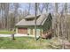 Charming home with a garage, inviting deck and surrounded by a beautiful, wooded area at 1032 E Woodall Ct, Martinsville, IN 46151