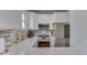 Well-lit kitchen features granite counters, stainless appliances, and ample cabinet space at 1032 E Woodall Ct, Martinsville, IN 46151