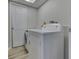 Bright laundry room features modern washer and dryer, with convenient storage solutions at 1032 E Woodall Ct, Martinsville, IN 46151