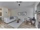 Bright living room features a plush sofa, stylish decor, and a ceiling fan at 1032 E Woodall Ct, Martinsville, IN 46151