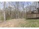 Picturesque view of the backyard, featuring lush greenery and a serene wooded area at 1032 E Woodall Ct, Martinsville, IN 46151