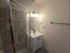 Contemporary bathroom featuring a walk in shower and white vanity with sink at 1038 W 33Rd St, Indianapolis, IN 46208