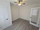 This cozy bedroom has a ceiling fan and a door with glass in this house at 1038 W 33Rd St, Indianapolis, IN 46208