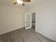 Bedroom featuring a ceiling fan, bright light, and hard floors at 1038 W 33Rd St, Indianapolis, IN 46208