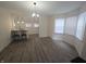 Bright dining area with modern lighting, breakfast bar and open access to the kitchen at 1038 W 33Rd St, Indianapolis, IN 46208