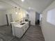 Bright kitchen features stainless steel appliances, white cabinets, and an undermount sink at 1038 W 33Rd St, Indianapolis, IN 46208