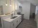 Bright kitchen with stainless steel appliances, white cabinets and a modern design at 1038 W 33Rd St, Indianapolis, IN 46208