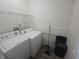 Bright laundry room featuring a washer, dryer, and storage options, designed for convenience at 1038 W 33Rd St, Indianapolis, IN 46208