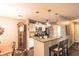 Efficient kitchen with breakfast bar, white cabinetry and stainless appliances at 1057 Timber Creek Dr # 1, Carmel, IN 46032